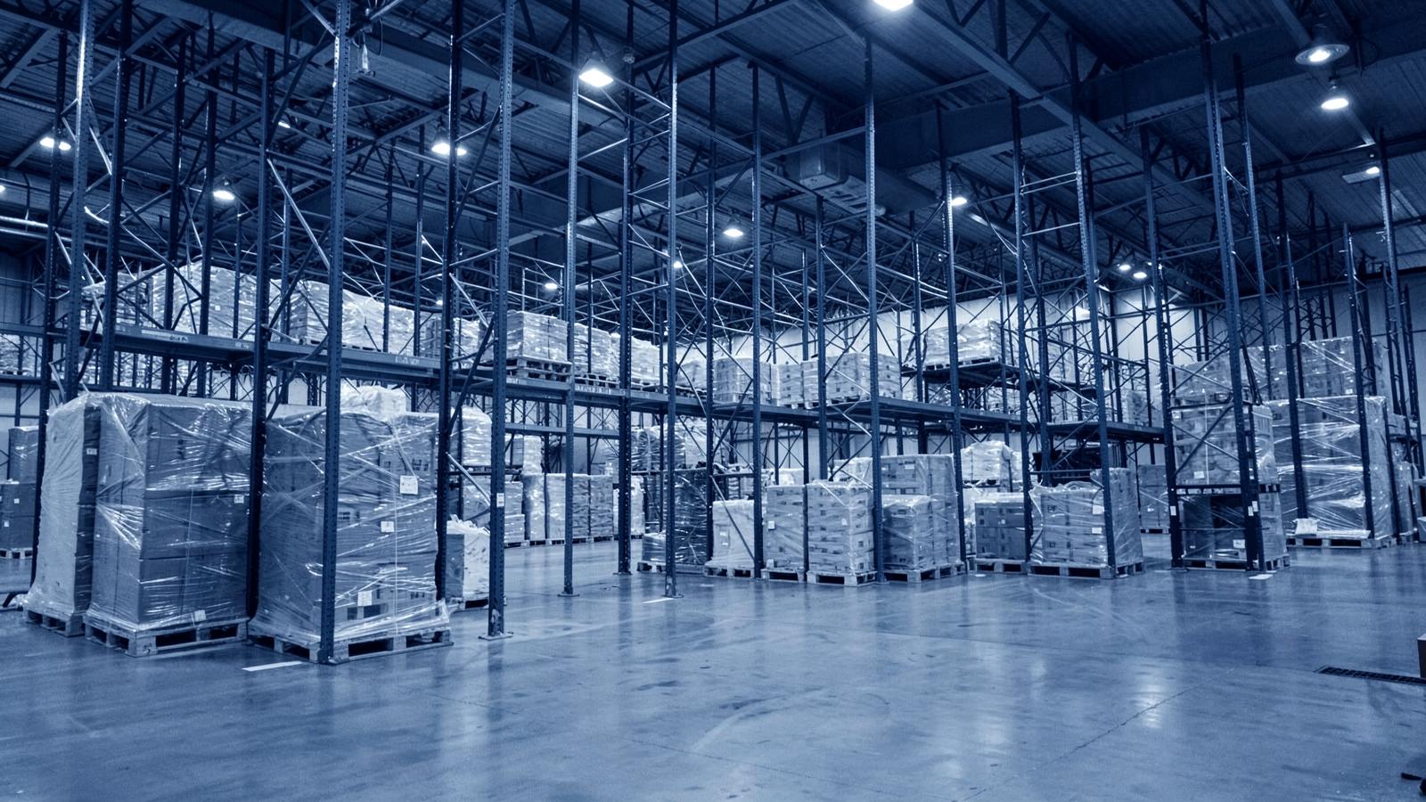 Warehouse racking stacked with palletised cargo